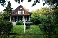 A Corcoran Group Inc. for sale sign hangs in the yard of a home in East Hampton, New York, U.S. on Wednesday, July 20, 2011. Home prices in New York's Hamptons, the Long Island resort towns favored by summering Manhattanites, increased 4.2 percent in the second quarter from a year earlier as buyers opted for more expensive beach properties. Photographer: Paul Taggart/Bloomberg