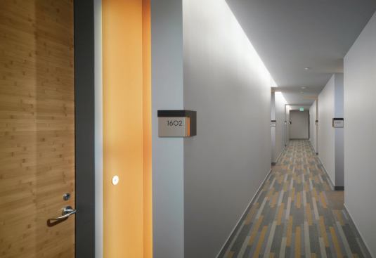 Numerous sustainable materials were used on interiors, including recycled carpet, FSC-certified wood trim and doors, and low- or no-VOC paints and adhesives.