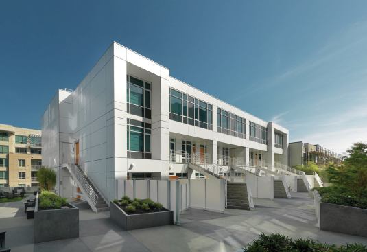 The exterior is bright-white, but is accented with jolts of color.