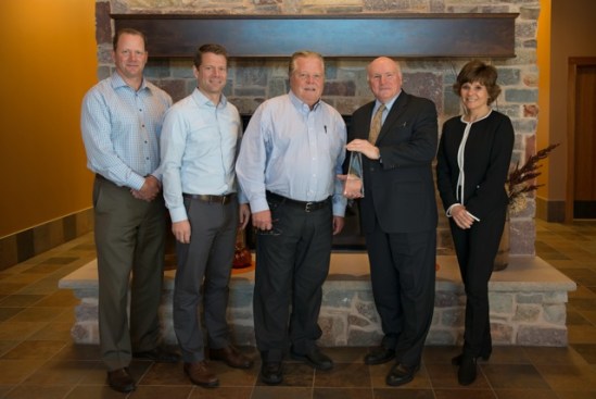 Marvin Windows and Doors receives the 2014 ABEA. Left to right: Dan Marvin, Paul
Marvin, John W. “Jake" Marvin, Richard Weber (Chair of the Foundation for
Financial Service Professionals), Susan Marvin.