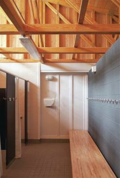 Formerly a series of bathrooms and showers that were dank and not ADA-compliant, the the falling-down pool house, built in the 1960s, got new life.