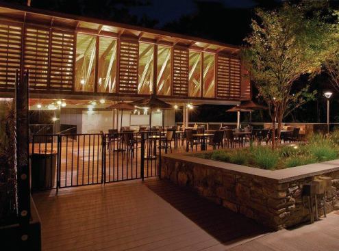 The renovated pool house has become a community hub. On a summer Saturday night, when families come to grill dinner and hang out with friends and neighbors, it's hard to nab a table.