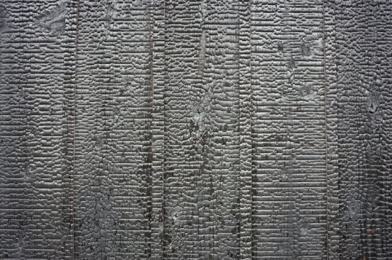 Charred wood is another finish material being used more frequently on Japanese houses. It's an ancient technique that produces a highly durable, low maintenance, thin and beautiful finish for the wood. 