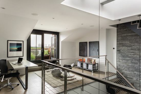 The third-floor office opens onto a new balcony. The floating stair visible at right leads to a roof deck.