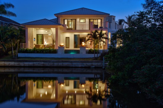 The back of the house overlooks a waterway.