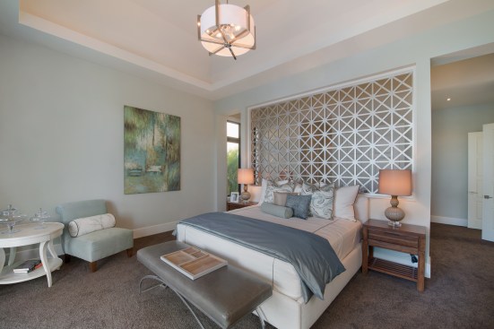 The home’s highlight is a resort-style Master Retreat with a screen divider and specialized closets.