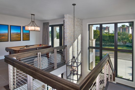 The loft can be used as a billiards room, library, studio, or guest lounge.