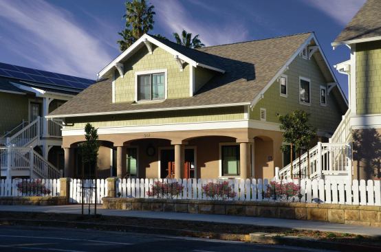 Grand, Affordable Project - Over 30 du/acre. Builder: McGillivray Construction. Architect: Peikert Group Architects, LLP.

Bradley Studios has a residential-style façade, so it fits right into the neighborhood.  The façade fronts one building enclosing a central courtyard, with housing for special needs residents who earn between 30 and 60 percent of area median income.