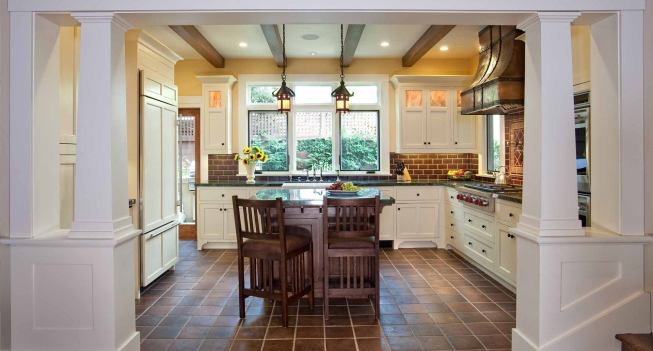 Grand, Custom Home Under 4,000 square feet. Builder: Hill Construction Company. Architect: IS Architecture.

Unique touches in the kitchen include quarter sawn oak exposed joists, a handmade copper and iron hood façade and antique lighting fixtures.