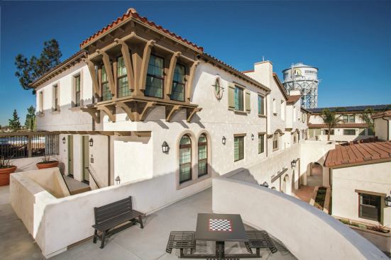 Grand, Residential Project of the Year - Attached Product within a Suburban Setting. Builder: Advent Companies. Architect: Bassenian Lagoni.

This transit-oriented development, with homes configured as townhomes-over-flats, is affordable housing that looks upscale.