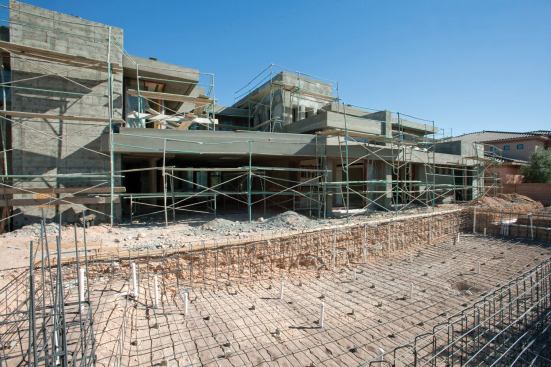 MONEY PIT: Domanico Custom Homes has sunk an unbudgeted $800,000 of its own   money into the project and owes another $400,000 to subcontractors and suppliers. The $1.8 million of financing the company seeks will pay off those debts and finish the house, including an infinity-edged pool  that anchors an extensive outdoor living experience.