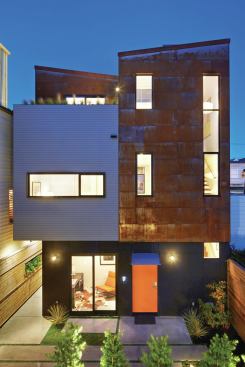 The same material palette of stucco and painted wood siding was applied to both buildings with the addition of corten to the front unit. 