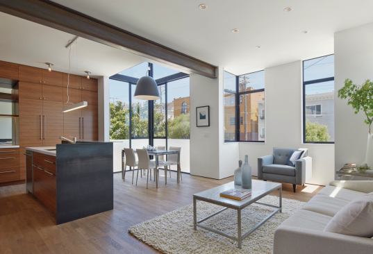 Corner windows can be done for a reasonable budget using commercial products and the inclusion of so much natural light is well worth the investment. The jury made note of "luminous interiors with light from nay angles."