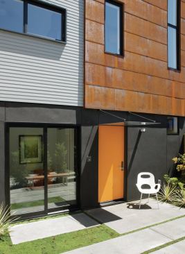 Both houses open out onto a shared courtyard that serves as dual front yards. 