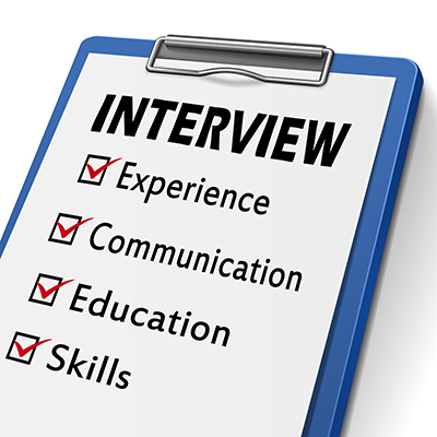 interview clipboard with check boxes marked for experience, communication, education and skills