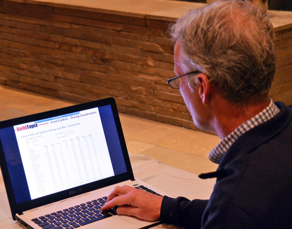 Alan Banks, marketing director for Evans Coghill, shows off the company's new software system.