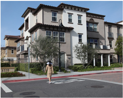 Brandywine Homes developed Renaissance Plaza in Stanton, Calif., from a blighted commercial area (below) into a moderately priced mix of much-needed new housing.