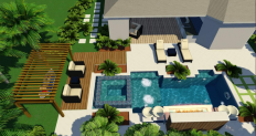Florida foliage surrounds the pool in this backyard landscape