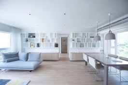 The Living spaces feature a large bookshelf that appears to be floating.