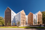 The building’s wings are clad in Englert metal siding and roofing, and bookended with façades of Belden Brick.