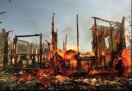 BEYOND SAVING: A home burns to the ground during the 2006 Esperanza fire. When wildfires outpace  firefighter resources, say experts, homes that ignite are typically destroyed.