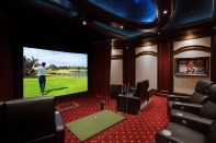 At the touch of a button, this home theater transforms into a golf simulator game room.