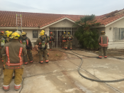 The Clark County Fire Department's live fire training exercise in progress at one of the abandoned homes provided by American West Development.