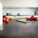 The Fonzie flat boasts technologies like this DuPont Corian charging countertop.