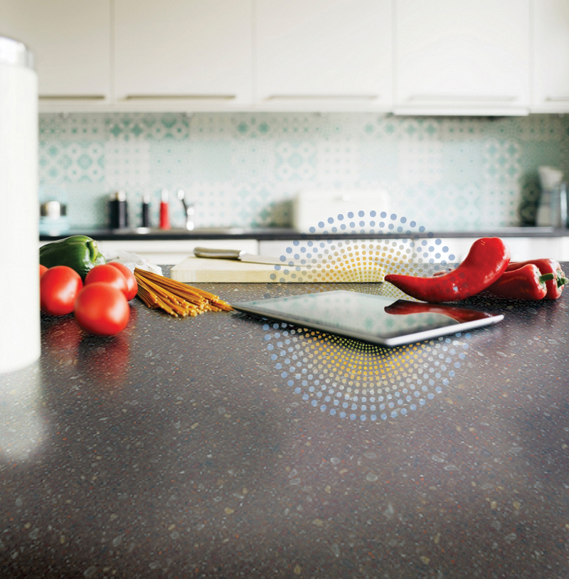 The Fonzie flat boasts technologies like this DuPont Corian charging countertop.