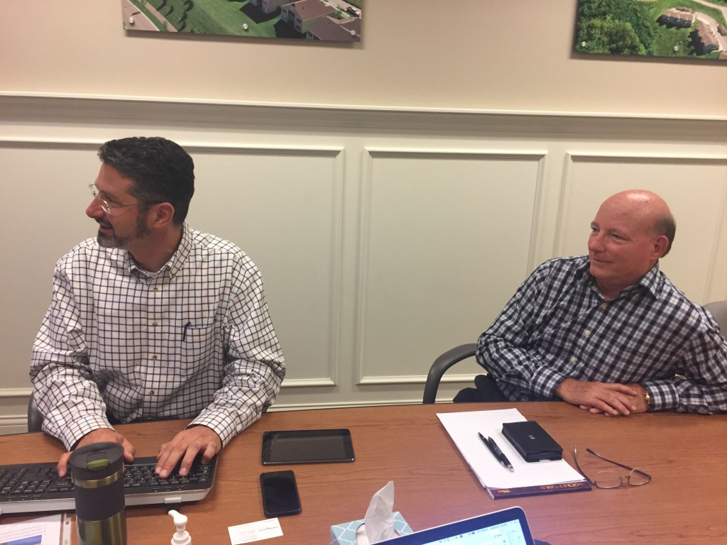 Christopher Niven and Robert Hawksley analyze the images from a drone survey.