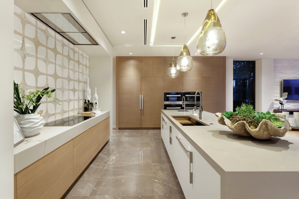 Shimmering, high-gloss finishes, double kitchen islands, and open living spaces are among 2017's biggest home trends, says designer Marc Thee.