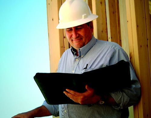 KEEPING TRACK: Village Homes senior safety manager Robert Fast knows “to the penny” how much an injury costs the company. The builder uses a designated medical clinic for all jobsite injuries, which helps pinpoint which trades and activities are prone to accidents.