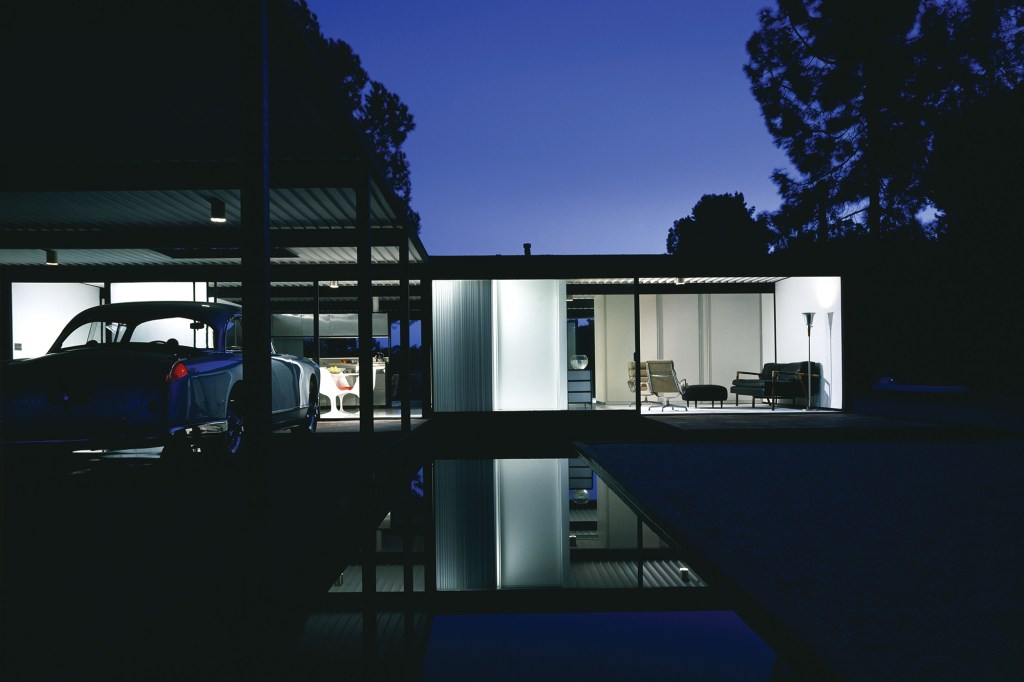 A512A1 Case Study House #21, Wonderland Avenue, Hollywood Hill, Los Angeles 1958 exterior at night with car.