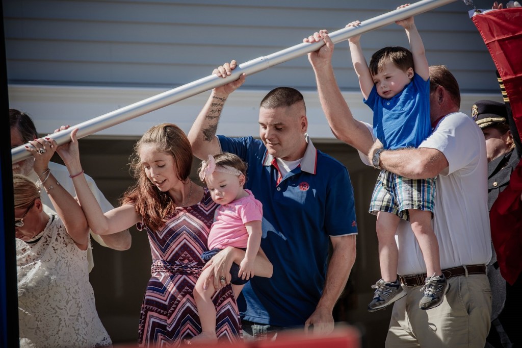 Cpl. Nate Rogers with his family at their flag raising ceremony in North Carolina.