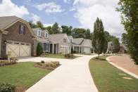 An avenue of model homes at Cresswind Charlotte by KOLTER HOMES.