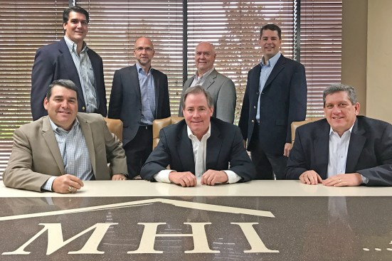 Comprising the executive team of McGuyer Homebuilders, Inc., (MHI) are (bottom row, from left) Gary Tesch, President; Frank McGuyer, Chairman and Chief Executive Officer; David Bruning, Chief Financial Officer (top row, from left) William ‘Mac’ McKinnie, General Counsel; Paul Blackburn, Houston Region President; Denny Garrett, Central Region President; and Keith Faseler, Division President Land Development.