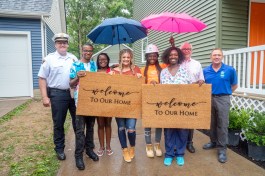 From left: City of Cleveland Commander Brandon Kutz, homeowners Annetta and Jacob Watts, Country Music Star Lauren Alaina, homeowners Yulonda and Nayira Amey, Ply Gem CEO and Chairman Gary E. Robinette, John Habat President and CEO of Greater Cleveland Habitat for Humanity.