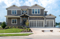 Summit Homes offers designs with three car garages in Kansas City, Mo.