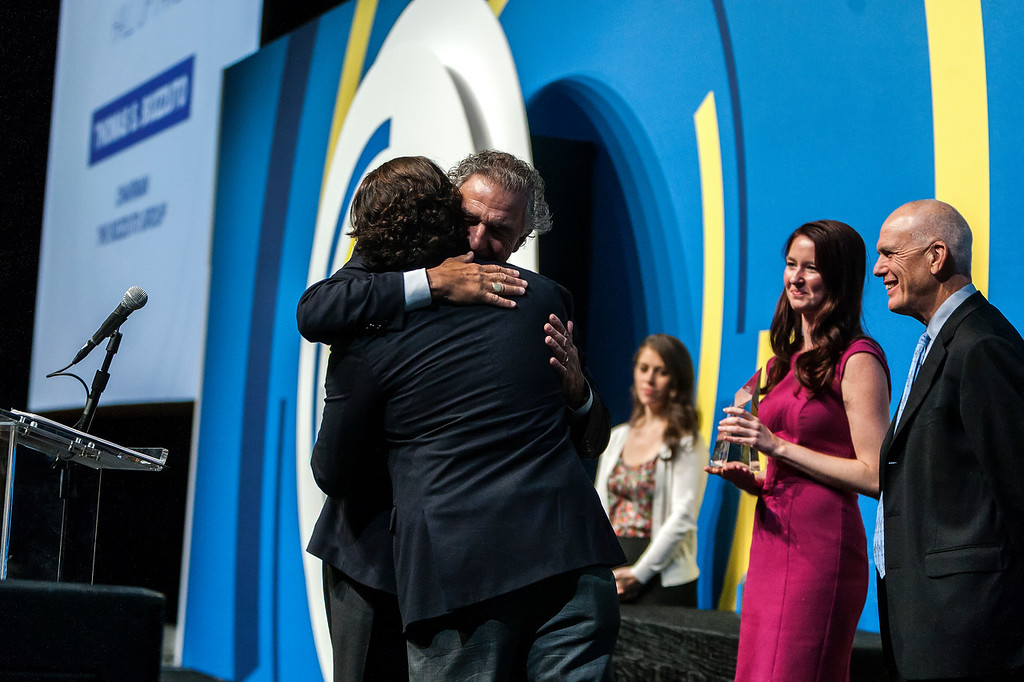 Tom and Toby Bozzuto embrace after Tom receives the MFE Hall of Fame award at the MFE Conference in September in Las Vegas.
