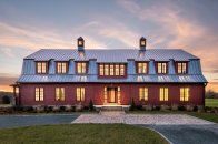The design team focused on highlighting the barn’s original window structure and replicated the pattern on the home’s new second level.