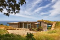 Dani Ridge in Big Sur, California, designed by Studio Schicketanz with mechanical engineering design from Monterey Energy Group, combines passive solar design with a propane boiler used for radiant heating.