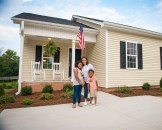 New homeowners in Raleigh, NC, happy to receive their new house keys. One of the nearly 500 homes built or remodeled through product donations by Ply Gem as part of the company’s Home for Good project.