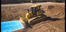 A Komatsu bulldozer equipped with Proactive Dozing Control logic.