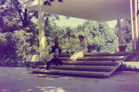 Edith Farnsworth (left) at the house she built with Mies