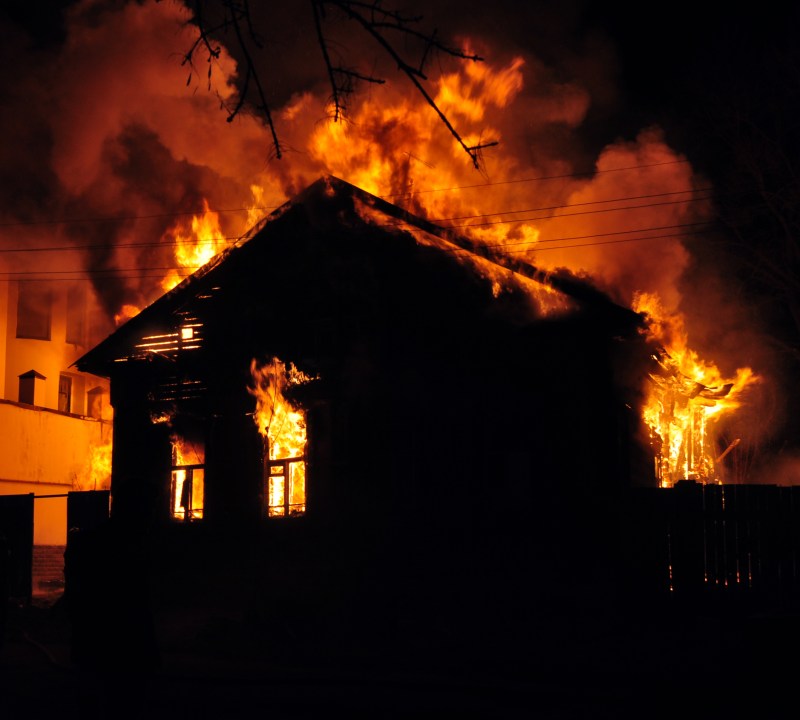 An old Wooden house burning in the fire