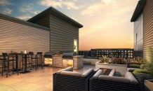 Rooftop patio and kitchen at 400 Littleton Village, by Century Communities