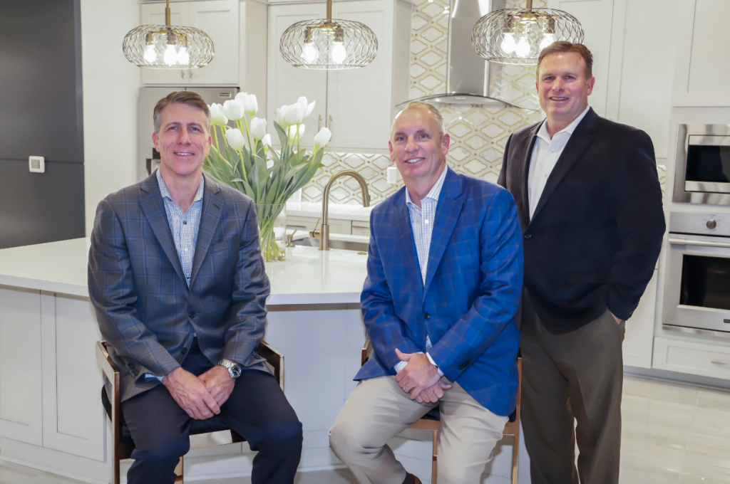 Left to right: Newmark Chairman and Chief Executive Officer Mike Moody, President Jeff Dye and new President of the Austin division Shay Brinkley.