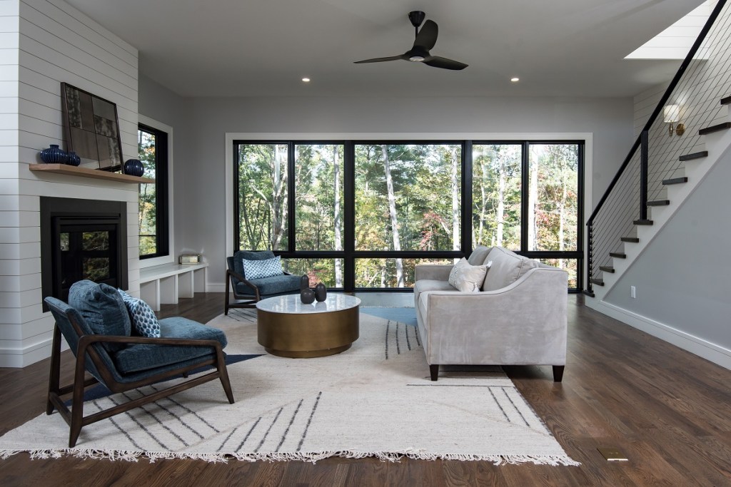 Large windows help facilitate a connection to the outdoors in the custom homes built by Red Tree Builders in North Carolina.