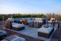 Airy Rooftop Gathering Space featuring Bloc Fire Bowl in Black Sand, Honed finish