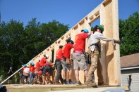 The wall-raising ceremony for a new Habitat home in the Thomasboro-Hoskins neighborhood of Charlotte, North Carolina.